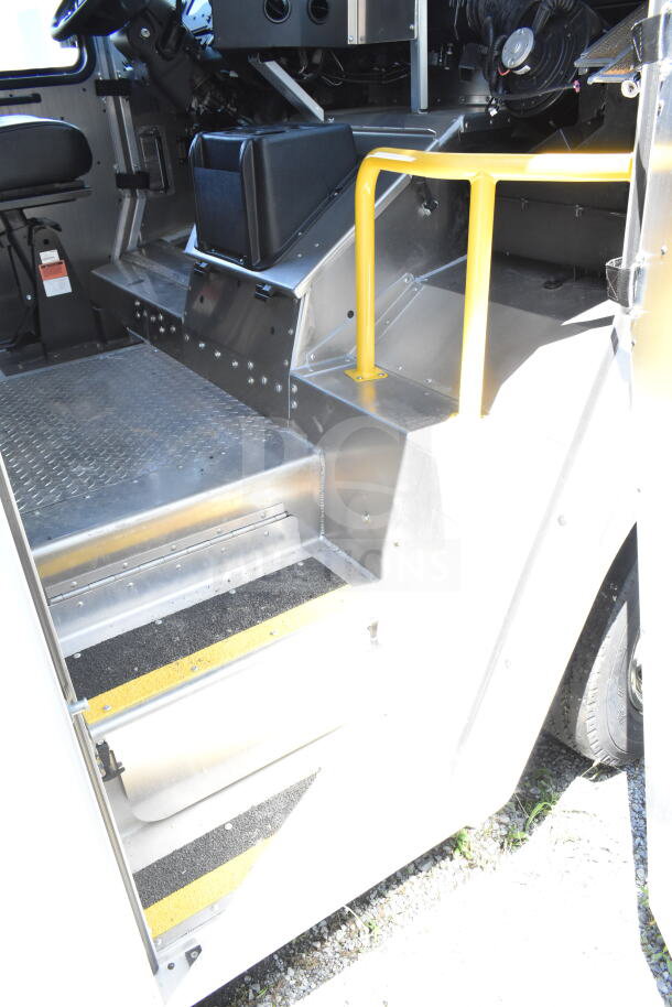 2021 Ford Step Van interior with steel steps, rubber grips, and yellow handrail; VIN 1F66F5KN3M0A01361.