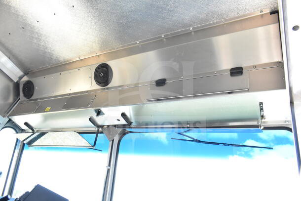 Interior of 2021 Ford Step Van, showcasing overhead storage with vents. VIN 1F66F5KN3M0A01361. Clean, like-new condition.