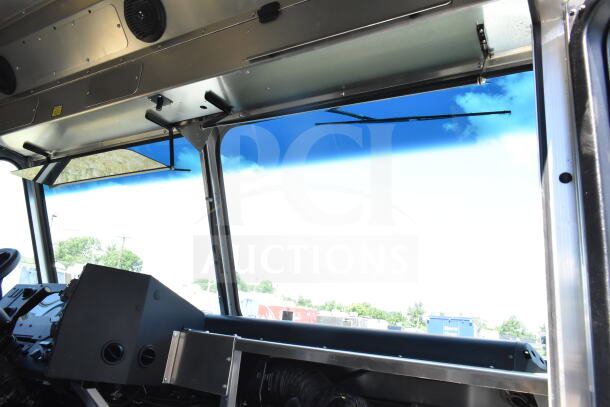 Interior view of 2021 Ford Step Van dashboard and windshield, showing the driver's side and overhead panel. VIN 1F66F5KN3M0A01361.