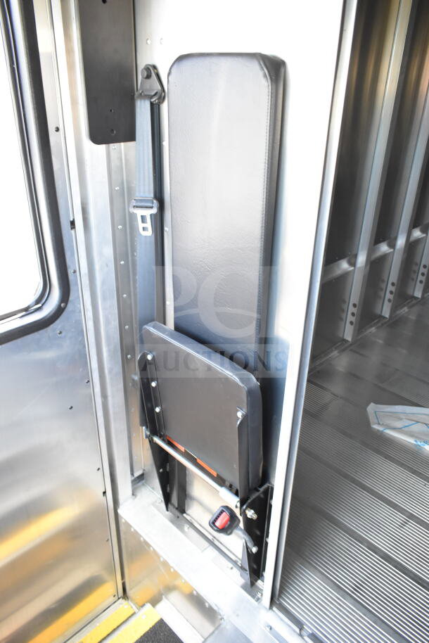 2021 Ford Step Van interior, showing foldable passenger seat with seat belt, in excellent condition. VIN: 1F66F5KN3M0A01361.