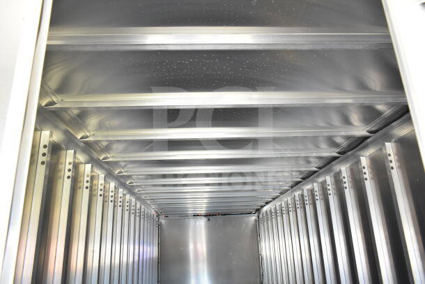 Interior view of 2021 Ford Step Van cargo area, showing aluminum walls and ceiling structure, VIN 1F66F5KN3M0A01361.