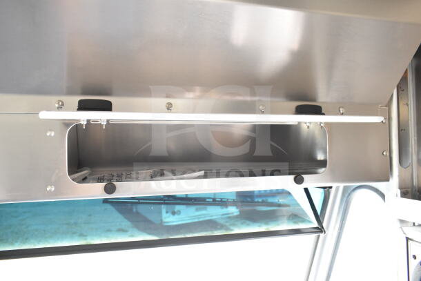 2021 Ford Step Van interior, featuring overhead storage with an open compartment, in pristine condition.