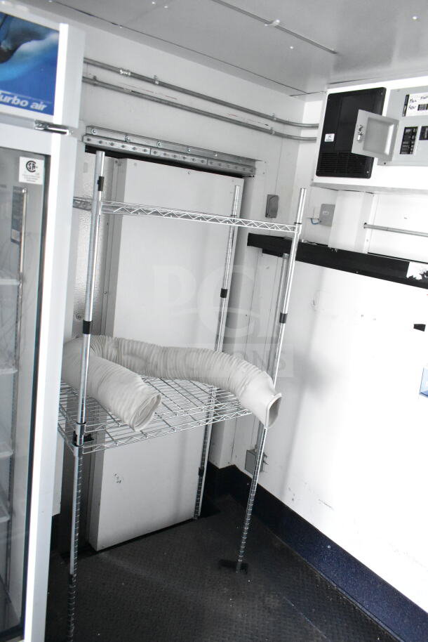 2020 Southern Dimensions 8.5x28 cold beverage/food trailer interior, showing shelving and cooling unit. VIN: 4S9S1EK20LW364346.
