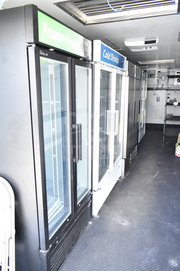 2020 Southern Dimensions 8.5x28 cold beverage trailer interior with refrigerated display cases labeled "Frozen Foods" and "Cold Drinks."
