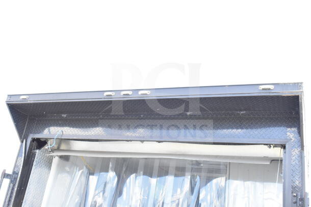 2020 Southern Dimensions 8.5x28 food trailer top view, diamond plate trim, open serving window with clear strip curtains.