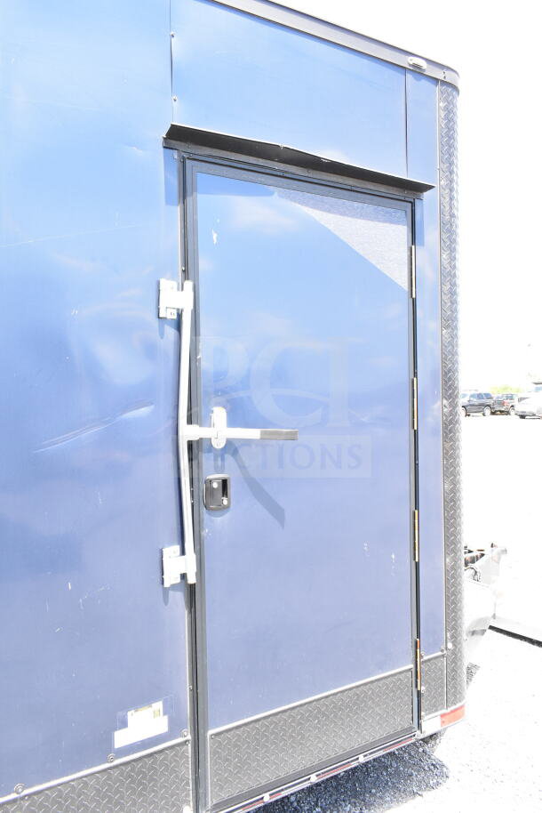 2020 Southern Dimensions 8.5x28 beverage/food trailer, blue exterior, door handles visible, with coolers and freezers.