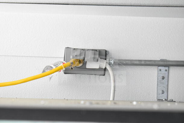 Electrical connections inside 2020 Southern Dimensions 8.5x28 beverage trailer. Secure wiring setup with yellow cable.