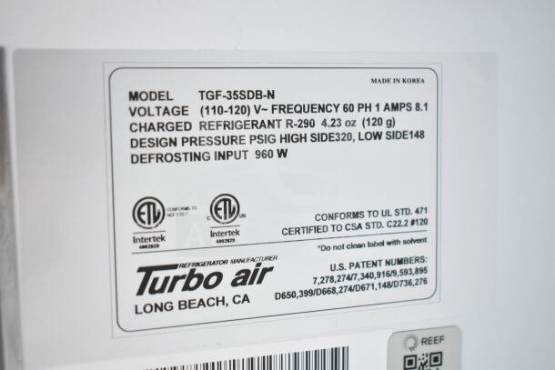 Turbo Air fridge label showing model TGF-35SDB-N, voltage 110-120V, and charged refrigerant R-290, 4.23 oz.