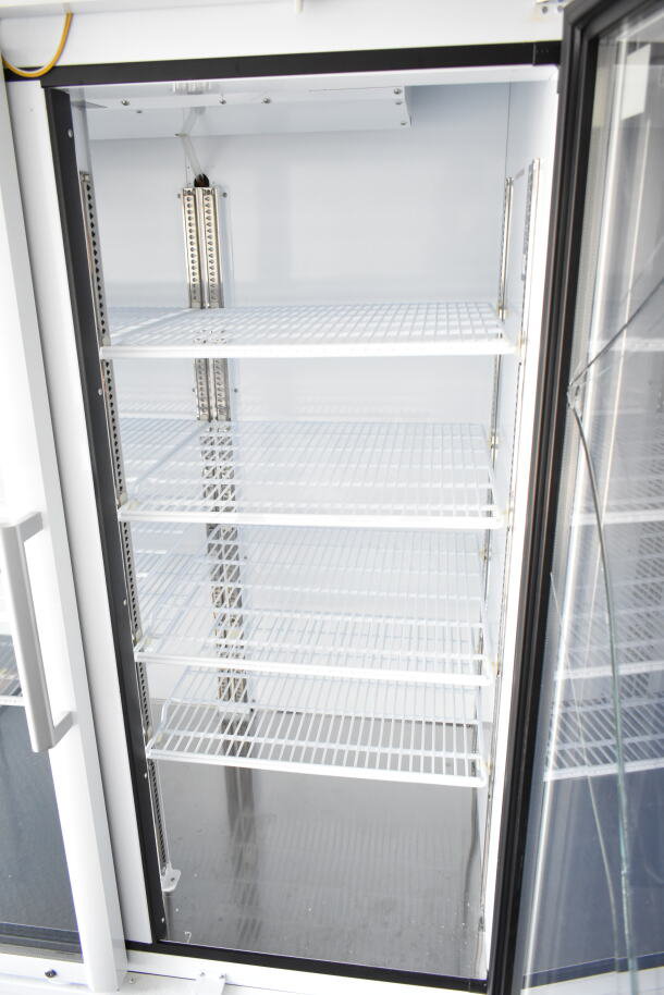 2020 Southern Dimensions food trailer interior with shelving, showcasing clean, spacious cooler/freezer units.