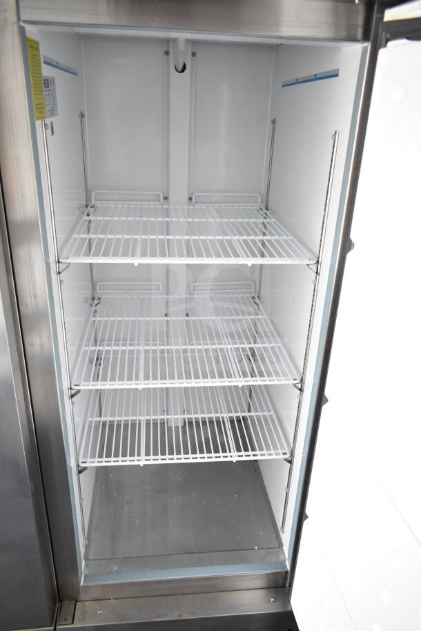 Interior view of Southern Dimensions trailer cooler with adjustable wire shelves, showcasing spacious storage capacity.