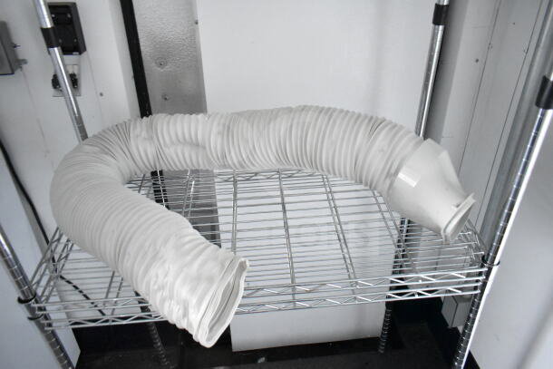 2020 Southern Dimensions 8.5x28 beverage trailer cooler interior with flexible duct on wire shelf.