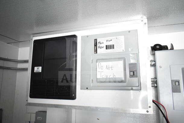 Interior paneling of a 2020 Southern Dimensions 8.5x28 beverage trailer. Features electrical controls with "Do Not Touch" label.