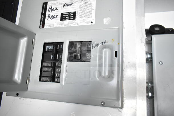 Electrical panel inside the 2020 Southern Dimensions 8.5x28 food trailer. Panel shows multiple breakers labeled "Main," "Rear," and "Front."