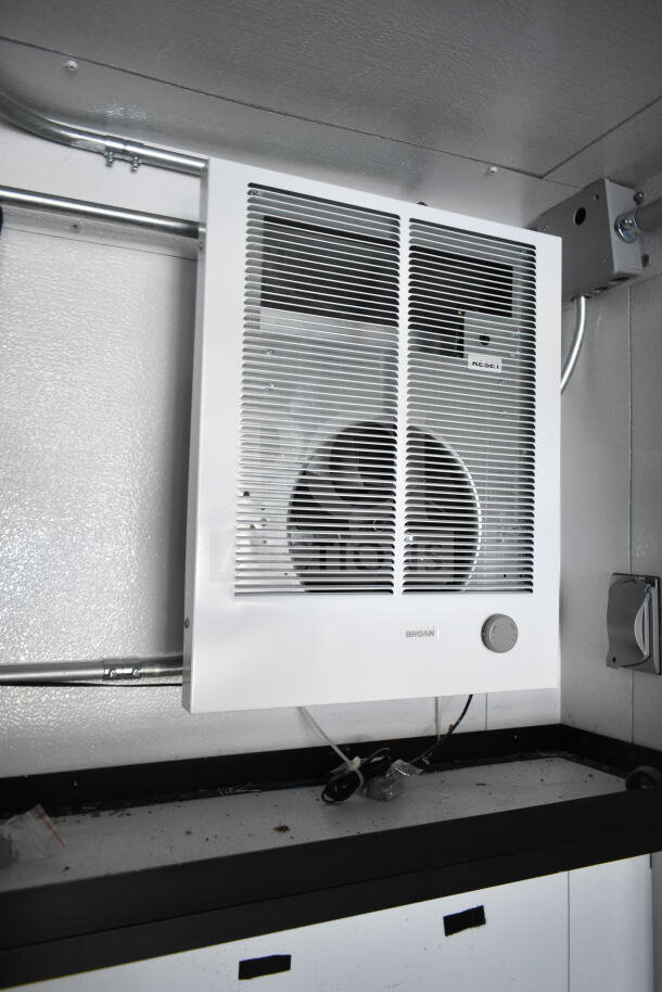 Interior view of a 2020 Southern Dimensions 8.5x28 food trailer, showing a white Broan ventilation unit mounted on the wall.