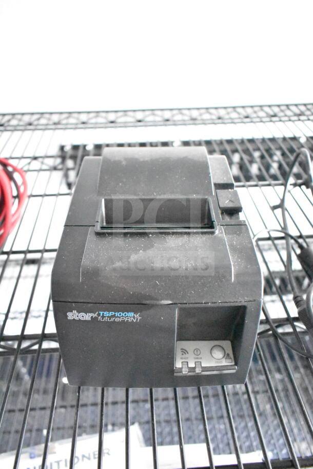 Star TSP100III printer on wire shelf, featuring futurePRNT branding and visible control panel with buttons.