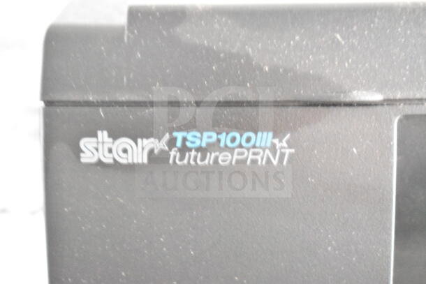 Star TSP100III futurePRNT printer, black. Visible text "Star TSP100III futurePRNT".