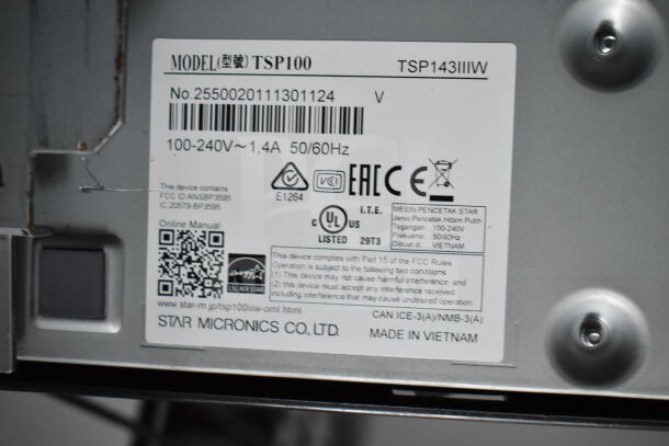 Metal label showing model TSP100, voltage 100-240V, and manufacturer Star Micronics Co., Ltd., made in Vietnam.
