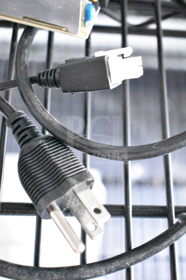 Close-up of power cables inside a Southern Dimensions 8.5x28 food trailer, showing electrical connections.