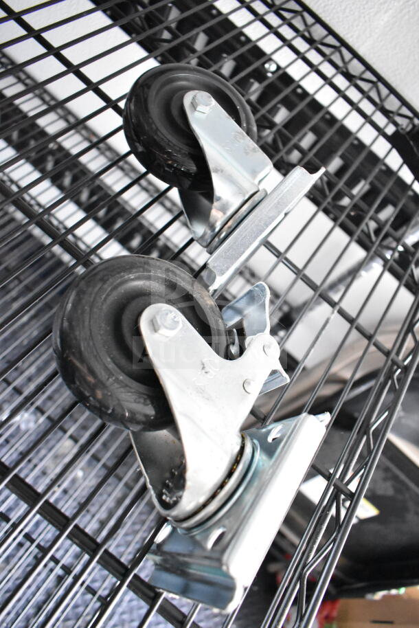 2020 Southern Dimensions 8.5x28 trailer caster wheels, metal and rubber, heavy-duty build, part of beverage/food setup.