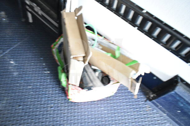 2020 Southern Dimensions 8.5x28 food trailer interior, showing disorganized boxes. Trailer comes with coolers, freezers.
