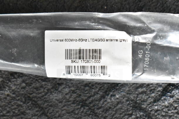 Universal 600MHz-6GHz LTE/4G/3G antenna (grey) in packaging with barcode and SKU: 170801-000 visible.