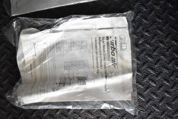 Instruction manual for Turbo Air refrigerators and freezers, sealed in plastic. Features operation guidelines and model specs.