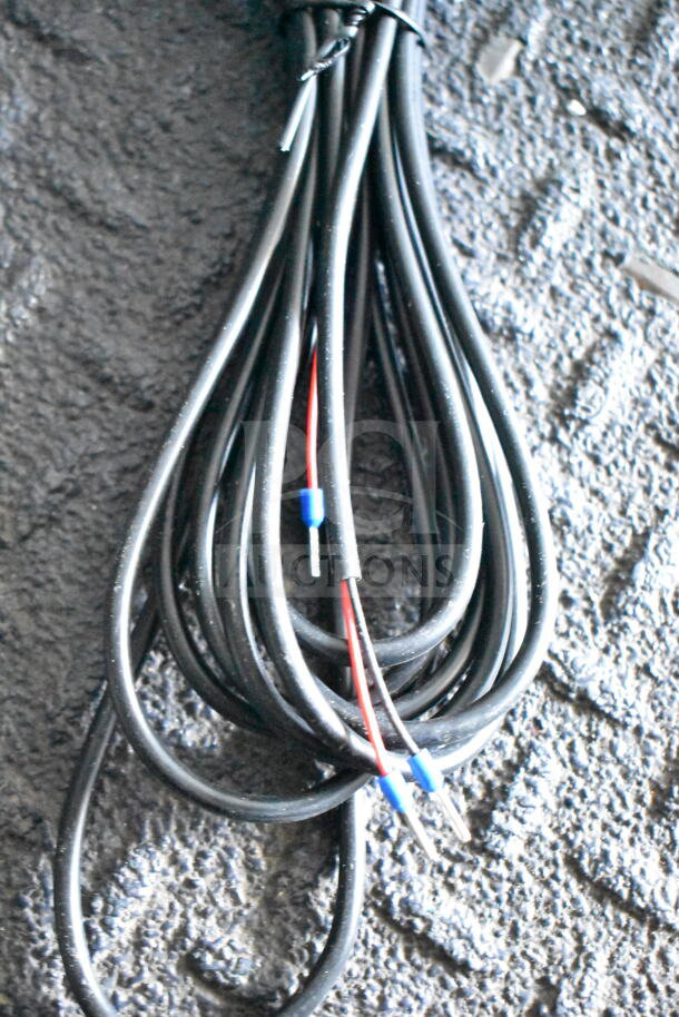 Coiled electrical wire with connectors for a Southern Dimensions trailer.