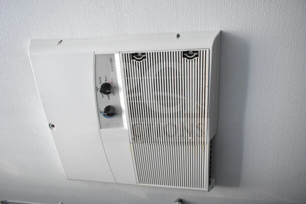 Ceiling-mounted air conditioning unit inside a 2020 Southern Dimensions 8.5x28 beverage trailer, featuring control knobs and ventilation grill.