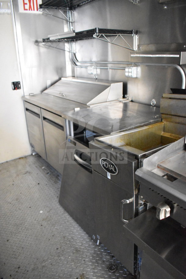 2021 Diamond Cargo 8.5x24 food trailer interior, stainless steel counters, Royal brand fryer, shelves, and wiring visible.