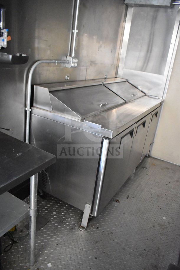 2021 Diamond Cargo 8.5x24 food trailer interior with stainless steel prep station, electrical wiring, and non-slip flooring.