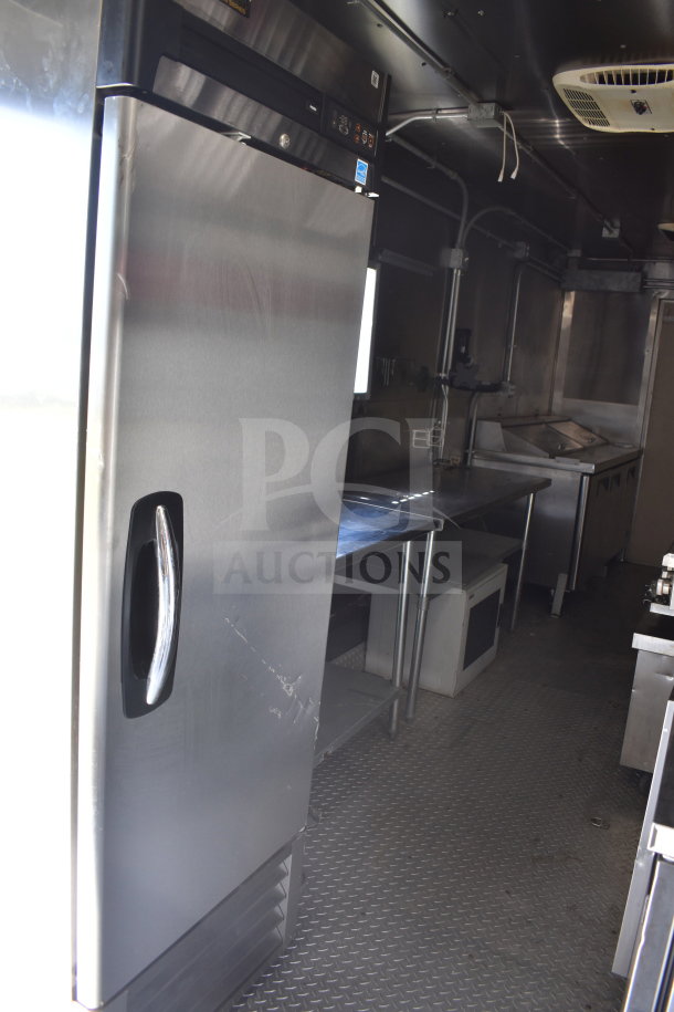 2021 Diamond Cargo 8.5x24 food trailer interior, stainless steel fridge, prep stations, and kitchen equipment visible.
