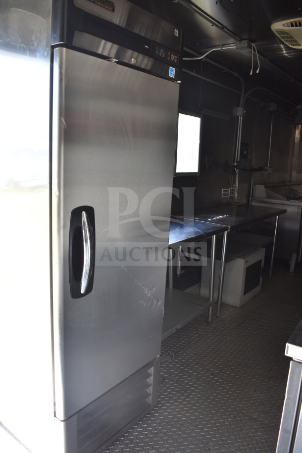 2021 Diamond Cargo 8.5x24 food trailer interior with refrigeration, stainless steel surfaces, and kitchen equipment.
