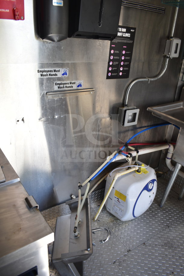 2021 Diamond Cargo 8.5x24 food trailer interior with hand wash sink, fire suppression, and refrigeration system.