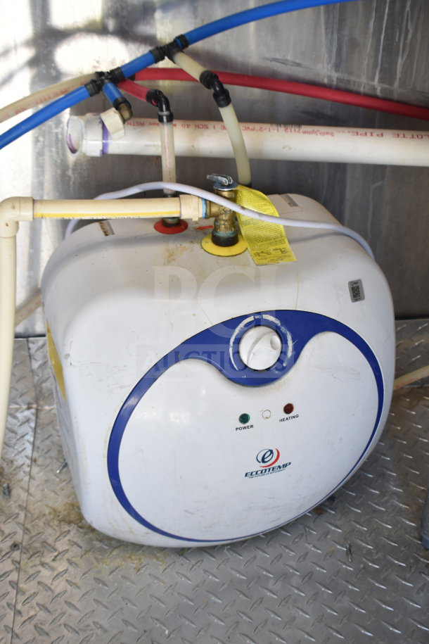 Eccotemp water heater in a 2021 Diamond Cargo 8.5x24 food trailer, featuring grease hood and fire suppression system.
