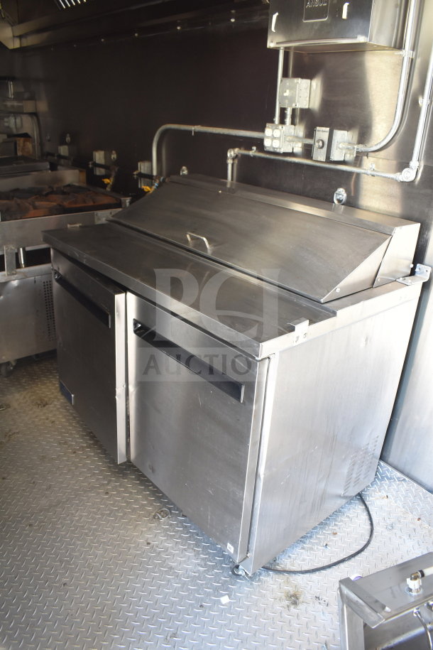 2021 Diamond Cargo 8.5x24 food trailer interior with stainless steel refrigeration unit, grease hood, and fire suppression system.
