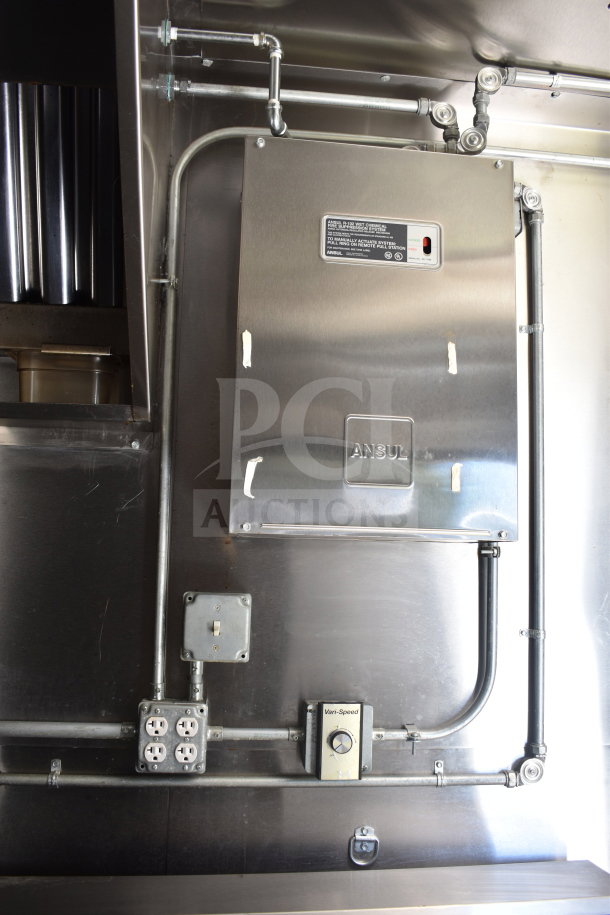 2021 Diamond Cargo food trailer interior, featuring Ansul fire suppression system, electrical outlets, and steel piping.