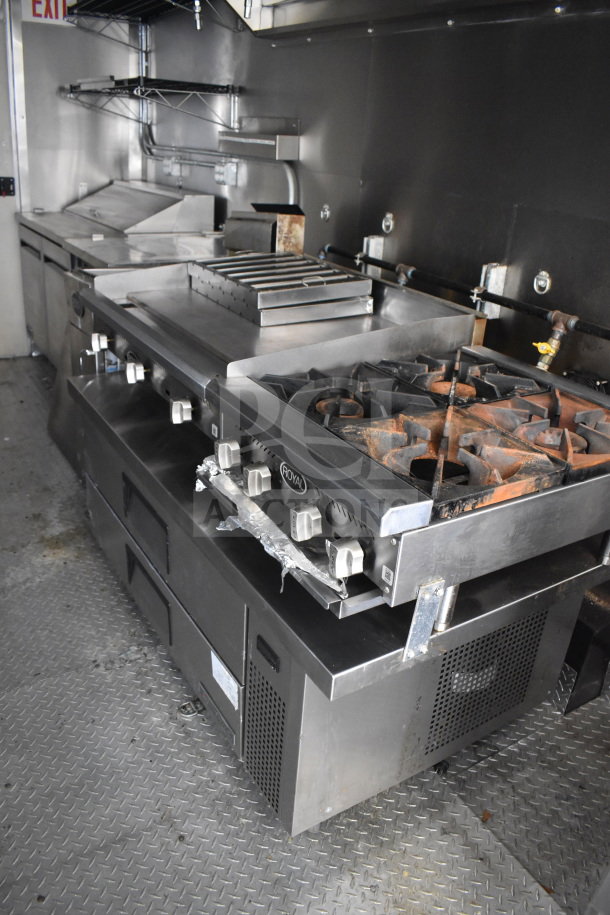 2021 Diamond Cargo 8.5x24 food trailer interior with Royal range, griddle, grease hood, fire suppression, refrigeration.