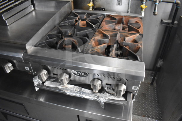 2021 Diamond Cargo food trailer interior showing Royal stove with griddle and range, equipped with grease hood.