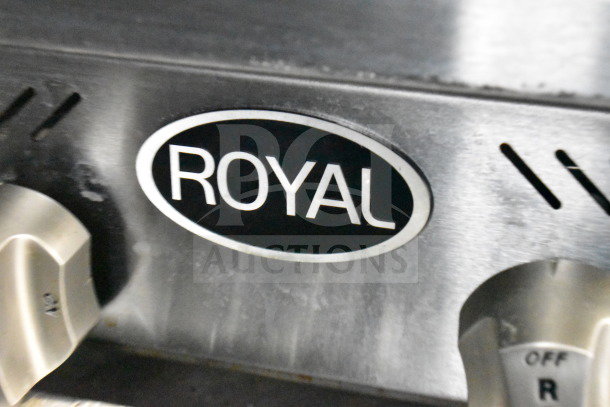 "Royal" emblem on stainless steel surface, showing part of a control panel with knobs on a commercial appliance.