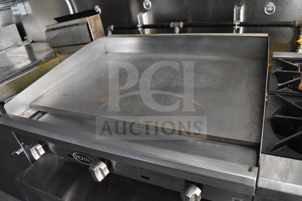 2021 Diamond Cargo 8.5x24 food trailer griddle with Royal branding, featuring knobs and stainless steel finish.