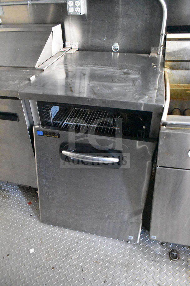 2021 Diamond Cargo 8.5x24 food trailer interior, featuring a Master-Bilt Fusion Series refrigerator, grease hood, and cooking range.