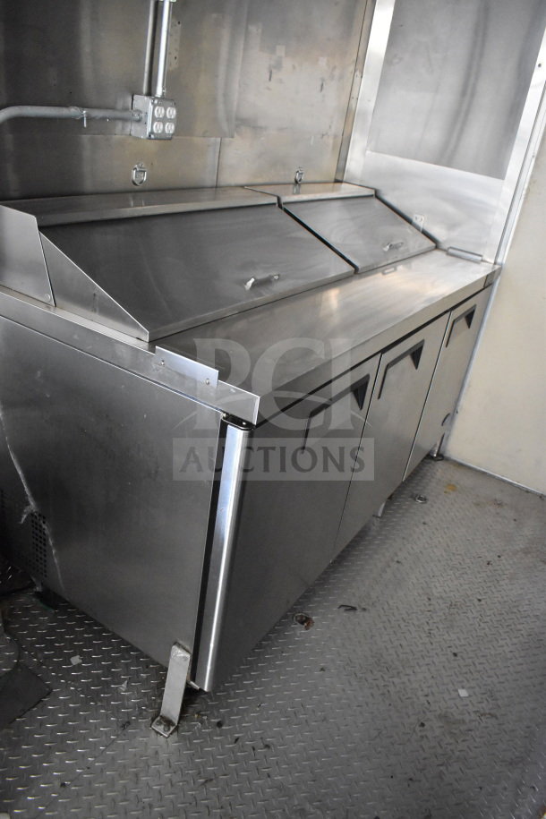 2021 Diamond Cargo food trailer interior showing stainless steel refrigeration unit with three compartments, in good condition.