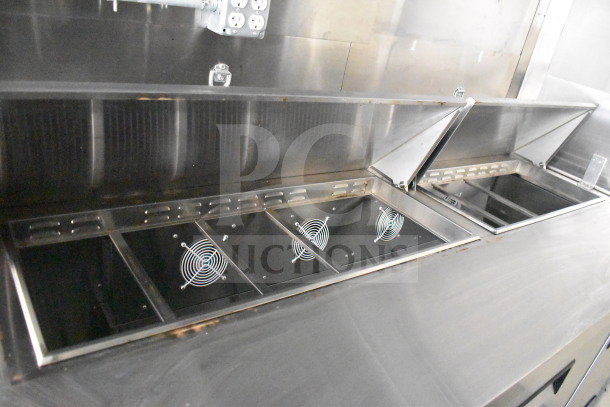 2021 Diamond Cargo 8.5x24 food trailer interior with grease hood and ventilation system, stainless steel finish.