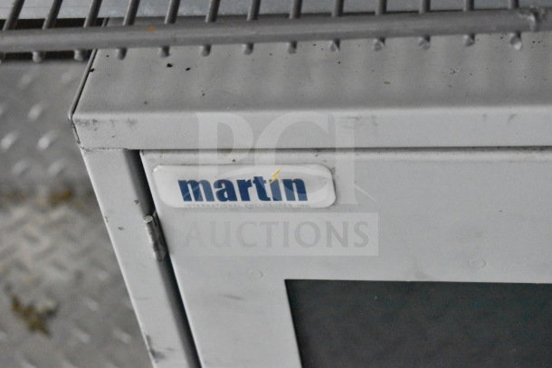 2021 Diamond Cargo food trailer detail showing "martin" label on equipment inside, part of fully outfitted kitchen setup.
