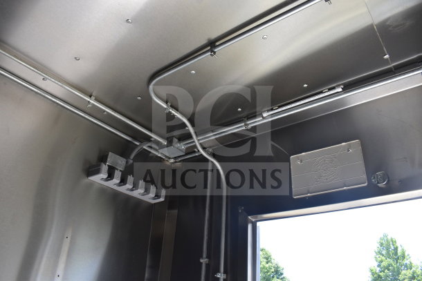 2021 Diamond Cargo 8.5x24 food trailer interior, showing electrical wiring and vent system, in excellent condition.