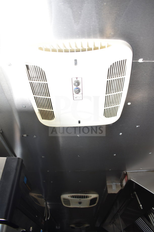 Interior of 2021 Diamond Cargo food trailer showing ceiling vent and fire suppression system.