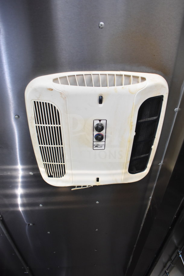 Interior vent of a 2021 Diamond Cargo food trailer, showing ventilation system; slight discoloration visible.