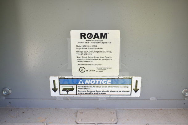 Image shows a label on a Diamond Cargo food trailer with ROAM Technologies power panel info, model MTC*6001 IESK2, 200A, 240V.