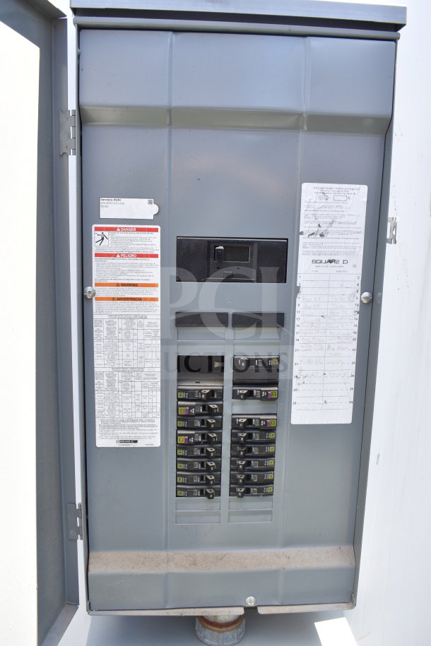 Electrical panel in the 2021 Diamond Cargo food trailer, showing circuit breakers and labels for power management.