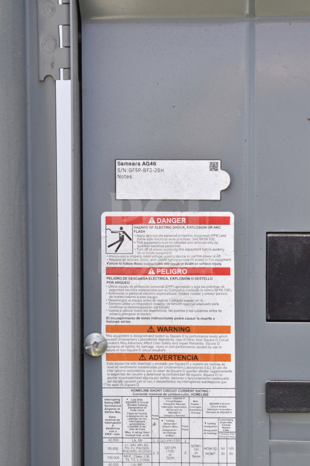 Power panel with warning labels displaying instructions for safe operation, visible labels by Samsara AG46 with serial number.